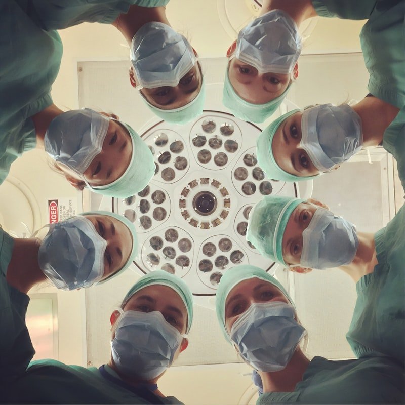 Senior doctor consulting family at home