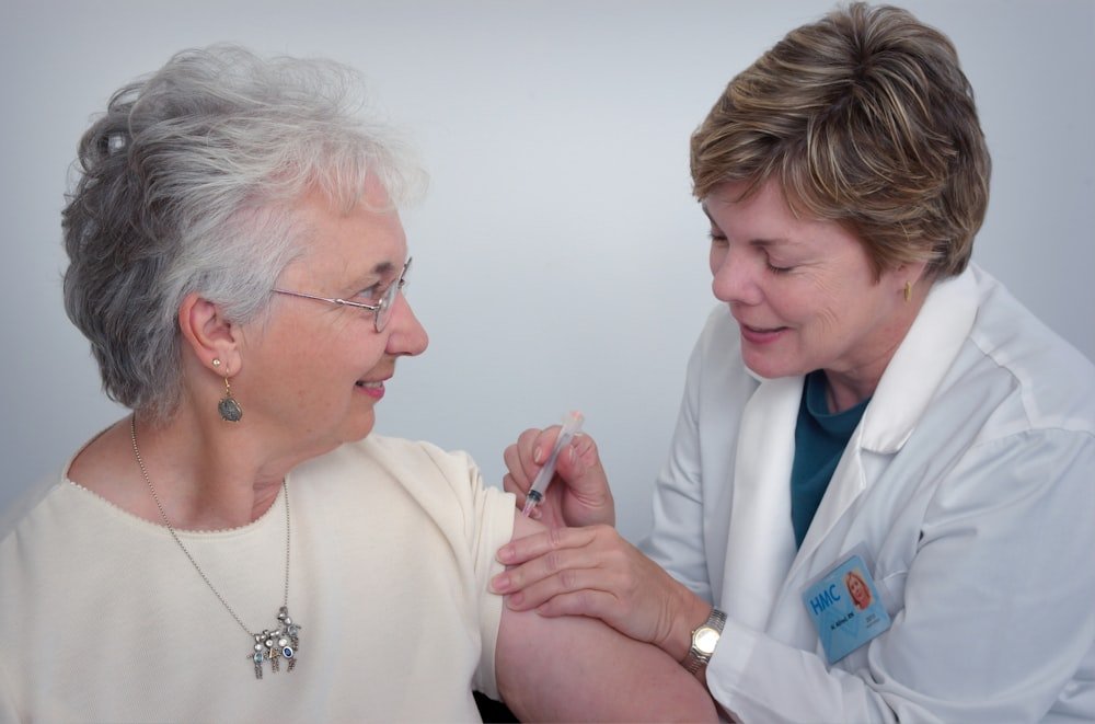 Professional Nurse providing home healthcare to senior patient